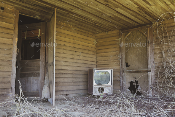 Old TV set on front porch of an abandoned homestead. - Stock Photo - Images