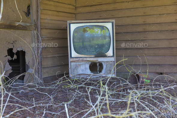 Old TV set on front porch of an abandoned homestead. - Stock Photo - Images