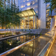 Seattle, a city plaza with modern architecture and water pool at night, lit up. - PhotoDune Item for Sale