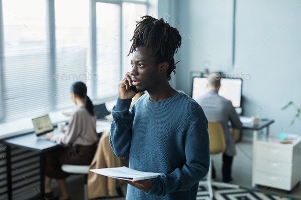 Black Professional Speaking on Phone - Stock Photo - Images