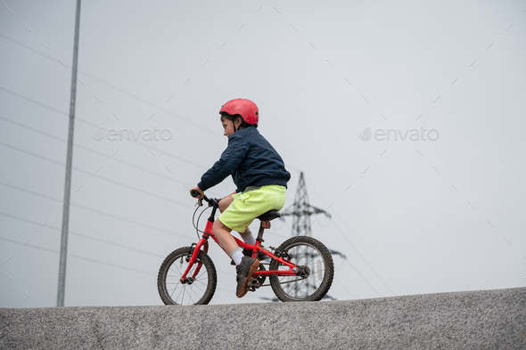 Young boy cycling pump track