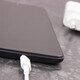 Black smartphone and unconnected cable of charger. Telephone charging - PhotoDune Item for Sale