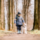 Small kid in blue jacket with white dog - PhotoDune Item for Sale