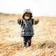 Small kid in yellow dry grass field - PhotoDune Item for Sale