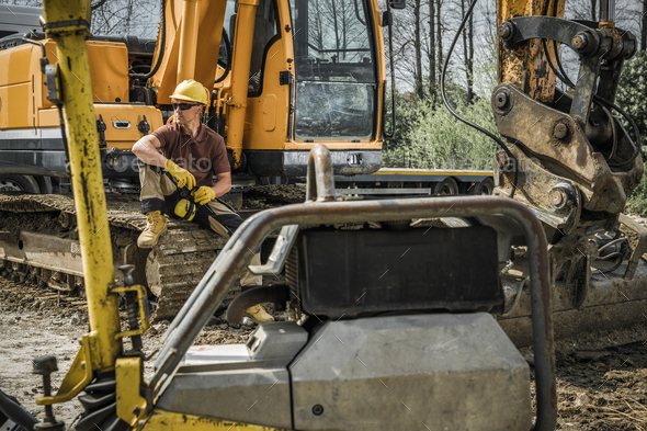 Heavy Duty Excavator Machine Operator on a Break