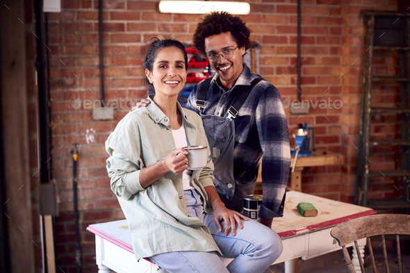Couple Running Business In Workshop At Home Restoring And Upcycling Furniture On Coffee Break - Stock Photo - Images