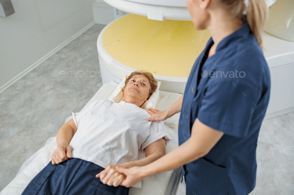 Doctor radiologist comforting a patient before the procedure of MRI or CT or PET Scan