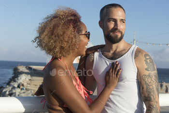Couple on sunny beach in summer vacation