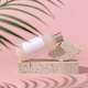 Cosmetic bottle with blank label lies on stone on light pink, palm leaf shadow, Mockup - PhotoDune Item for Sale