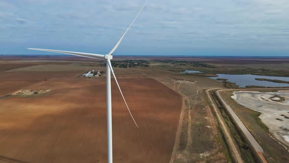 Aerial View of Powerful Wind Turbine Farm for Energy Production on Beautiful Seaside Landscape alt