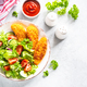 Chicken nuggets with fresh salad at white table. - PhotoDune Item for Sale