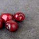 Sweet cherry on a stone black surface - PhotoDune Item for Sale