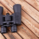 Black binoculars on a wooden surface - PhotoDune Item for Sale