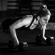 Cross training. Young woman exercising at the gym - PhotoDune Item for Sale