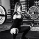Cross training. Female athlete lifting heavy barbells - PhotoDune Item for Sale