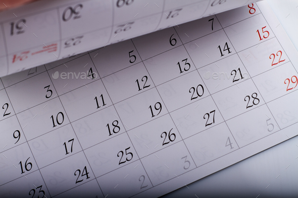 Turning month calendar page sheets with dates closeup-up. Stock Photo ...