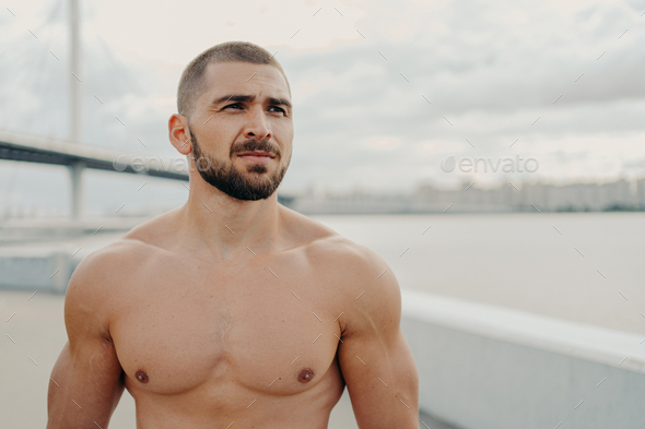 Muscular Man With Naked Torso Thick Beard Looks Somewhere Into Distance Stock Photo By Studiovk