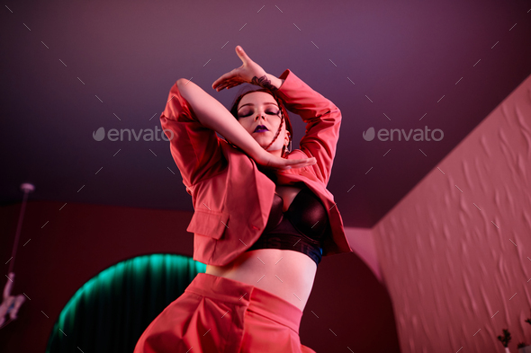 Young Woman Dancing Vogue Style Low Angle