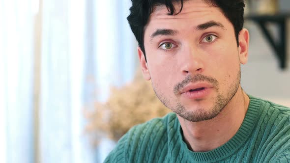 Close Up of Shocked AfroAmerican Man Face Looking at Camera alt