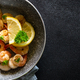 Frying shrimps with lemon in the frying pan. - PhotoDune Item for Sale