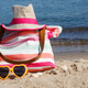 Accessories for relax or sunbathing on sand at beach. Travel and vacation time - PhotoDune Item for Sale