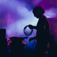 Silhouette of a stage worker standing on a stage with cables - PhotoDune Item for Sale