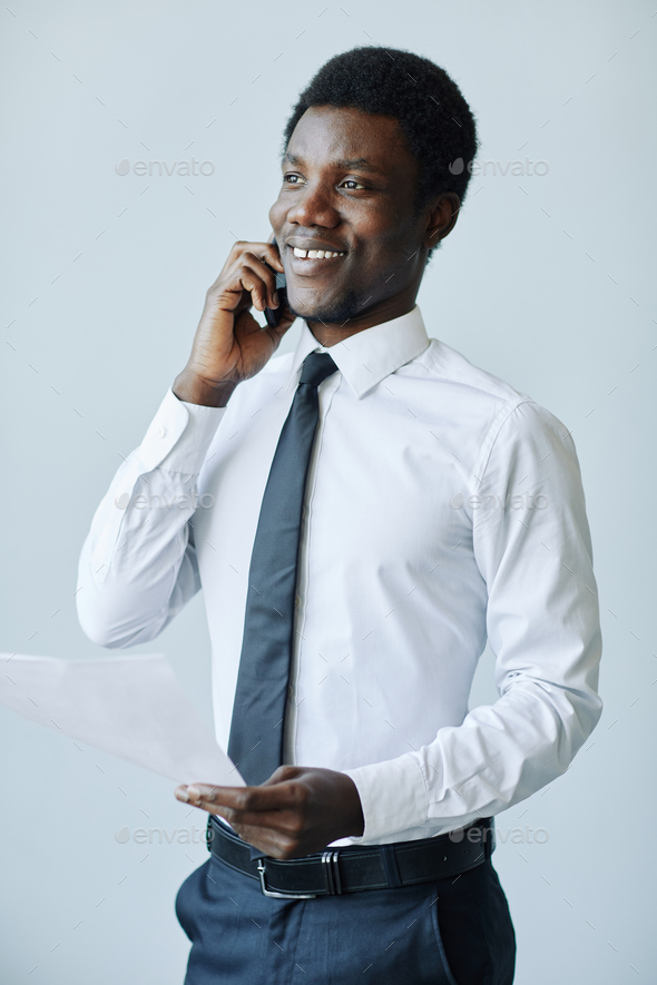 Black Businessman Speaking on Phone - Stock Photo - Images
