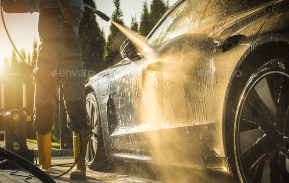 Men Washing His Car Using Pressure Washer - Stock Photo - Images