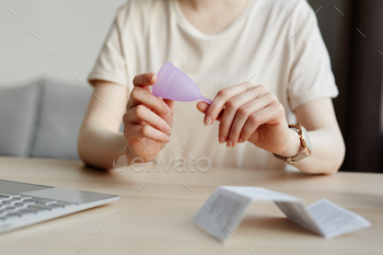 Young Woman Holding Menstrual Cup Closeup