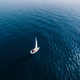 Yacht sailing on opened sea. Aerial view of sailing boat on sea surface. - PhotoDune Item for Sale