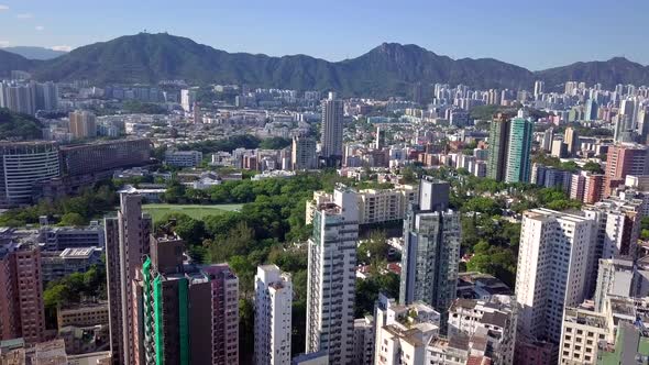 Drone fly over the Kowloon Peninsula in Hong Kong city alt