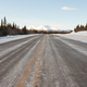 Winter on country road in taiga and snowy mountain - PhotoDune Item for Sale