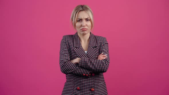 The Angry Young Woman with Her Hands to Her Ears Screams with Her Hands in the Middle Looks Unwell alt