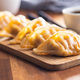 Chinese dumplings on cutting board. - PhotoDune Item for Sale