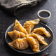 Chinese dumplings and soy sauce on plate. - PhotoDune Item for Sale