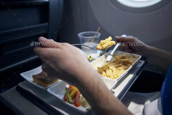 Passenger eating airline meal
