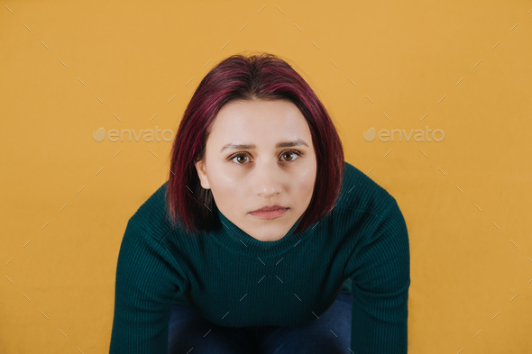 Studio portrait of unhappy young woman. Anger, Anxiety, Bipolar disorder