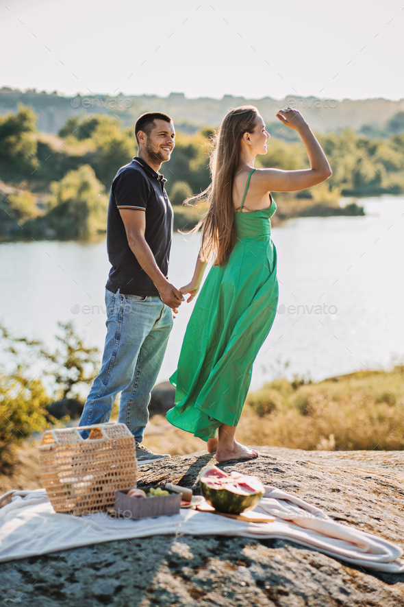 cheap-vacations-for-couples-candid-couple-in-love-holding-hands-on