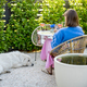 Woman relaxing at backyard during summer time - PhotoDune Item for Sale