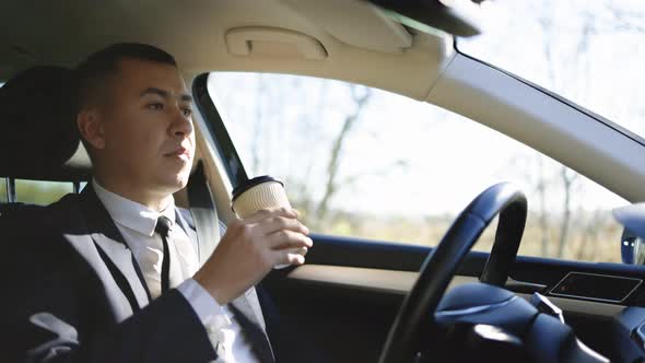 Confident Business Man Experience to Riding an Autonomous Self Driving Car