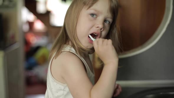 Little Girl Brushing Her Teeth in the Morning or Before Going to Bed