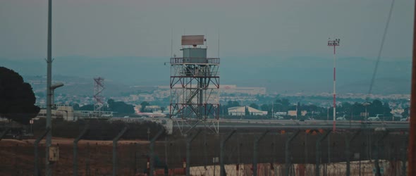 Plane take off on the runway, with radar tower in the background, BMPCC 4K alt