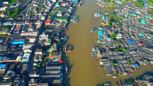 Aerial Shot of Local Fisherman Village Beside the sea alt