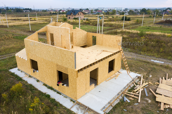 Construction of new and modern modular house. Walls made from composite wooden sip panels with