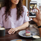 Hand of guy with smartphone taking photo of his girlfriend with cup of coffee - PhotoDune Item for Sale
