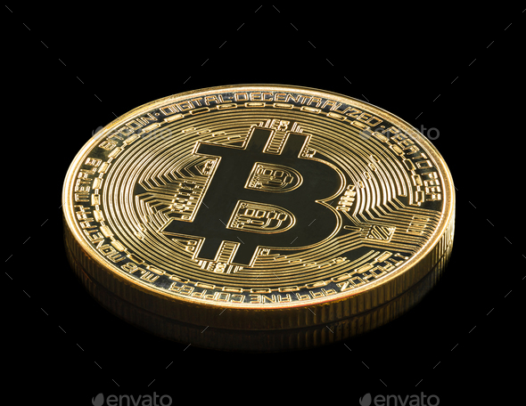 Golden coins with bitcoin symbol on black_