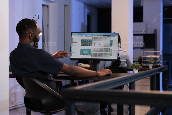 Hedge fund trader analyzing real time stock market sales - Stock Photo - Images