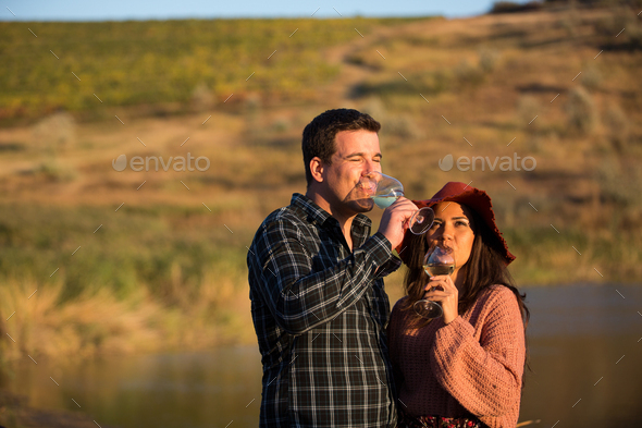 Wine grower couple enjoying a glass of wine