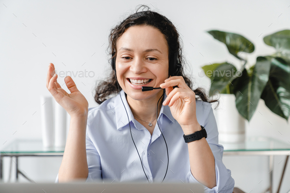 Front view portrait of a video call of mature middle-aged businesswoman IT support hot line