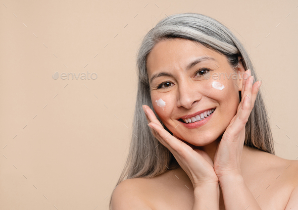 Anti-age anti-wrinkle effect of moisturizing creme cream. Caucasian mature middle-aged shirtless